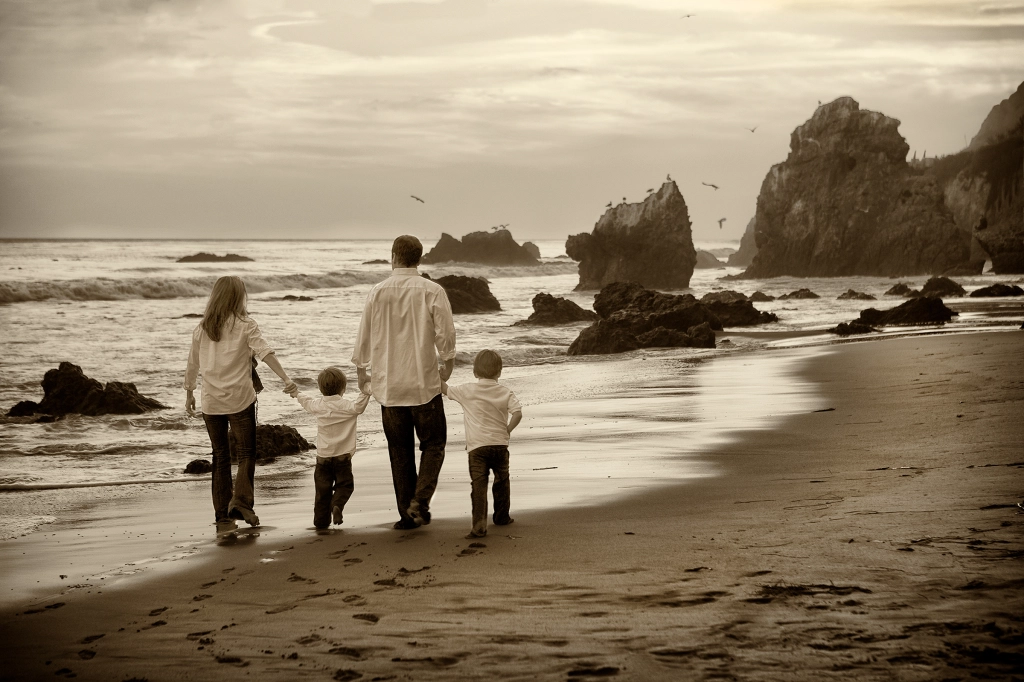 Family walking on the El Matador, CA, beach.