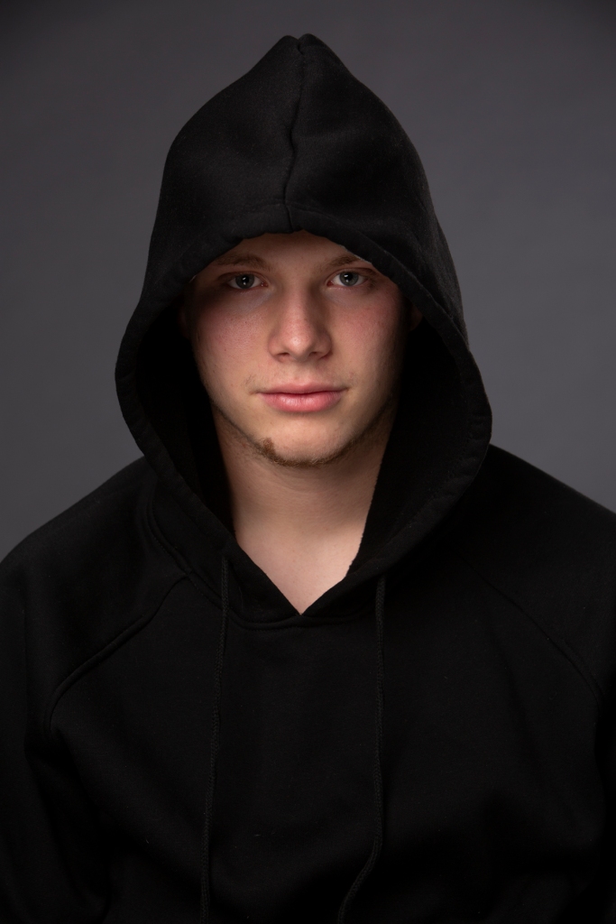 Teenager with hooded sweatshirt headshot